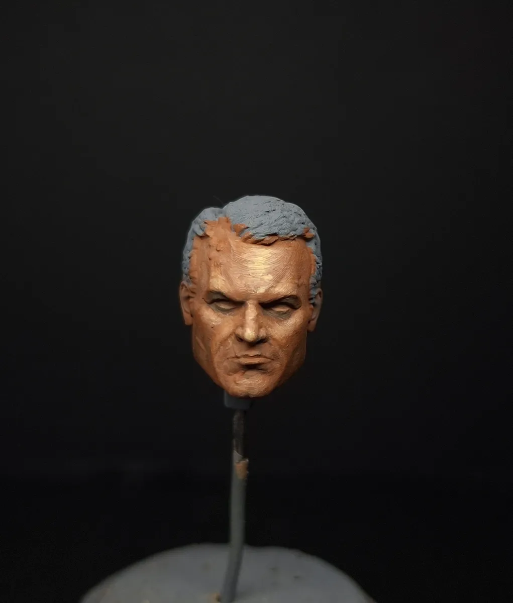 Day 1 baseline: a painted miniature face completed in 20 minutes